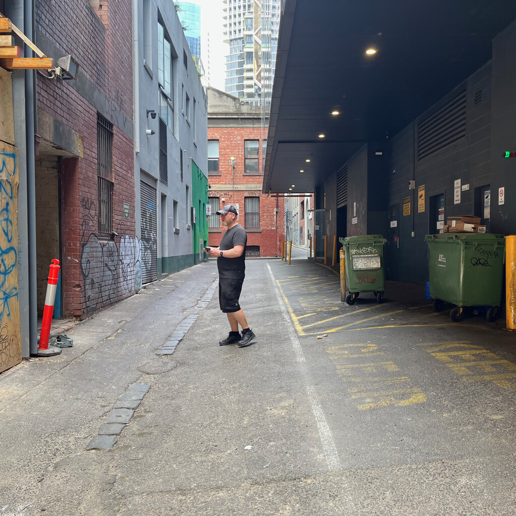 Photo of a man in an alley