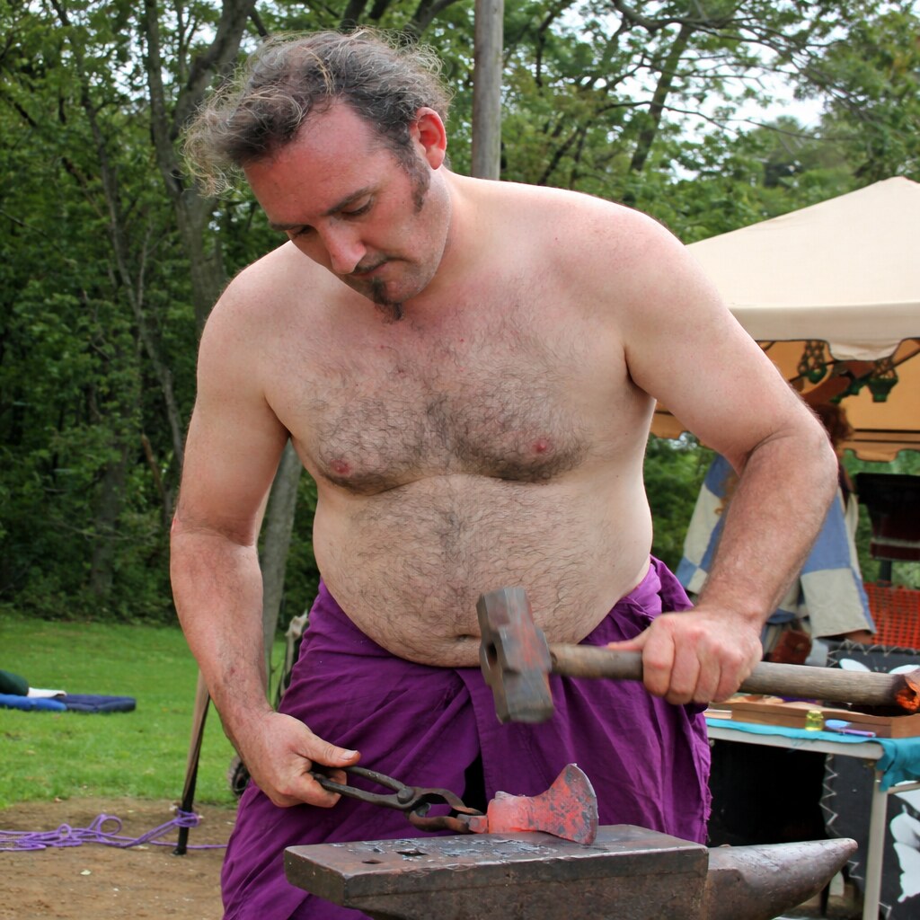 Photo of a blacksmith making an axe head