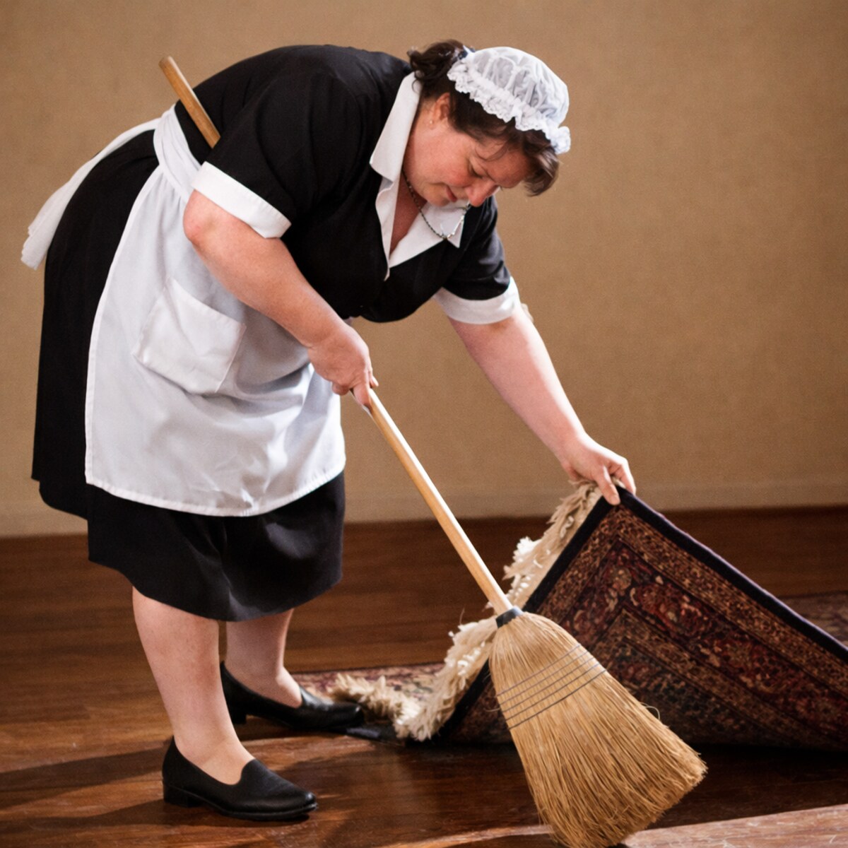 Generated image of a maid sweeping something under a rug