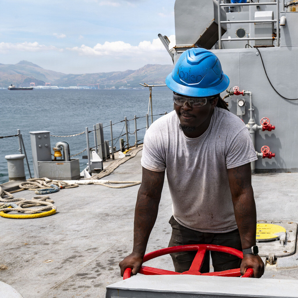 Photo of a ship's deck and some crew