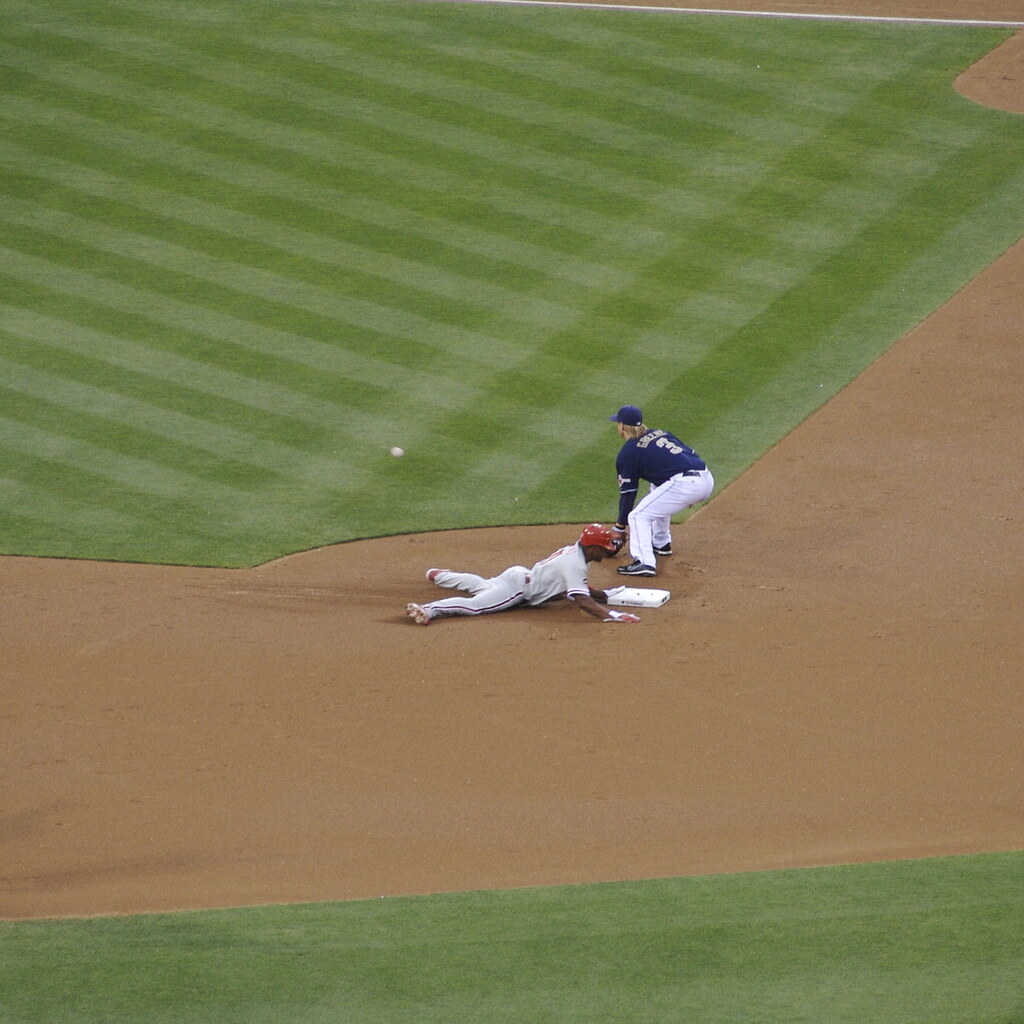 Photo of someone sliding to second base