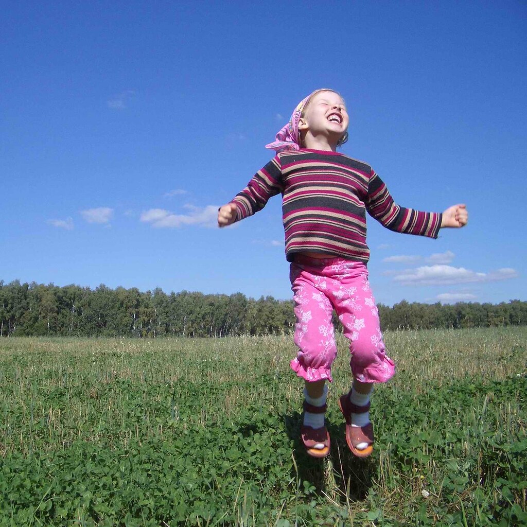 Photo of a girl jumping for joy