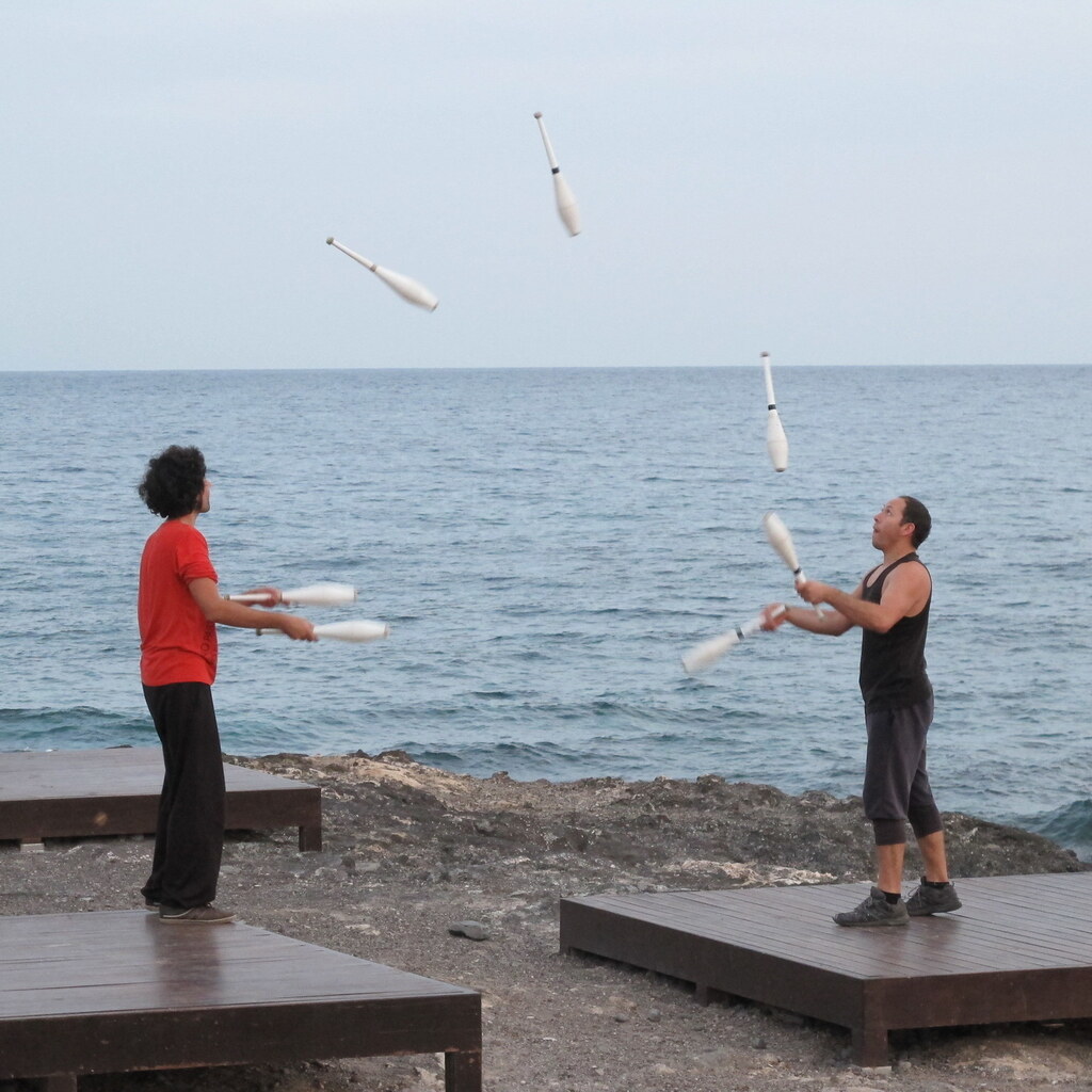 Photo of a two men juggling