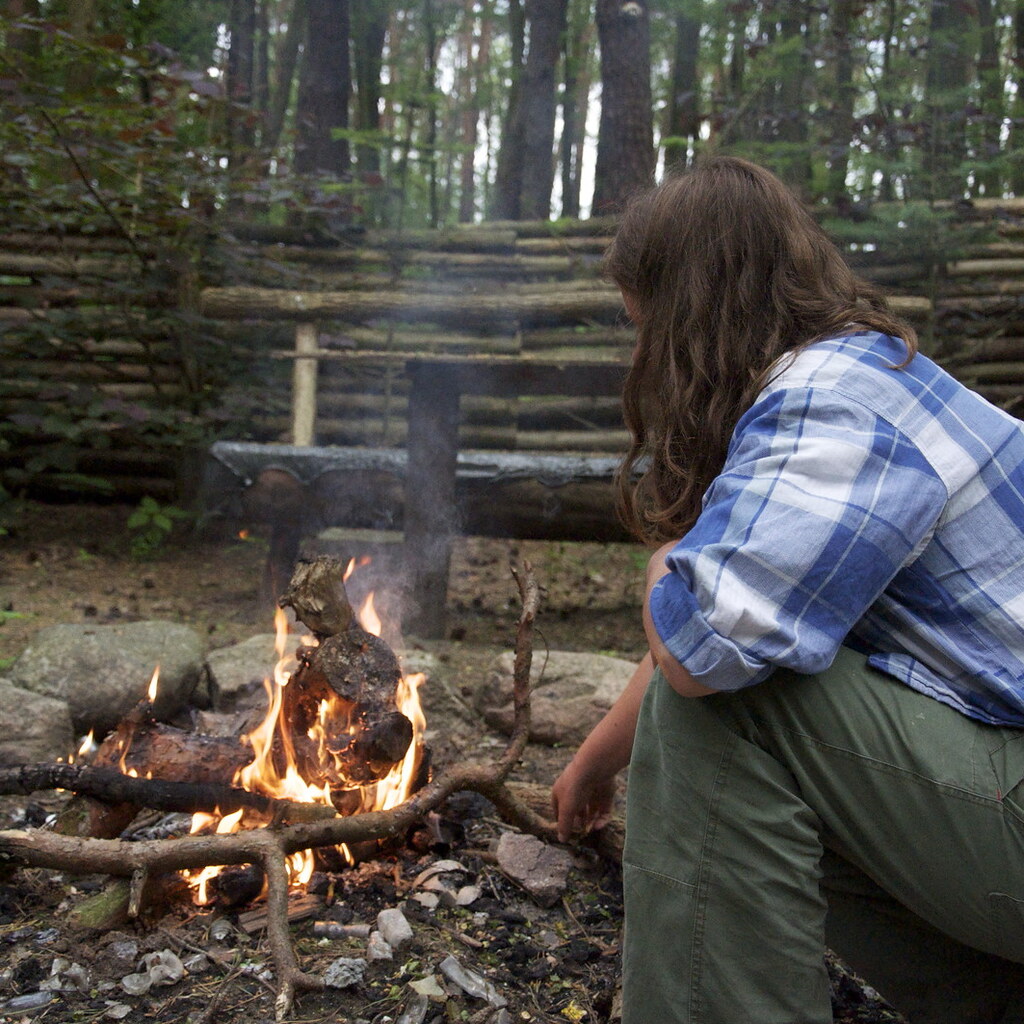 Photo of a man starting a fire