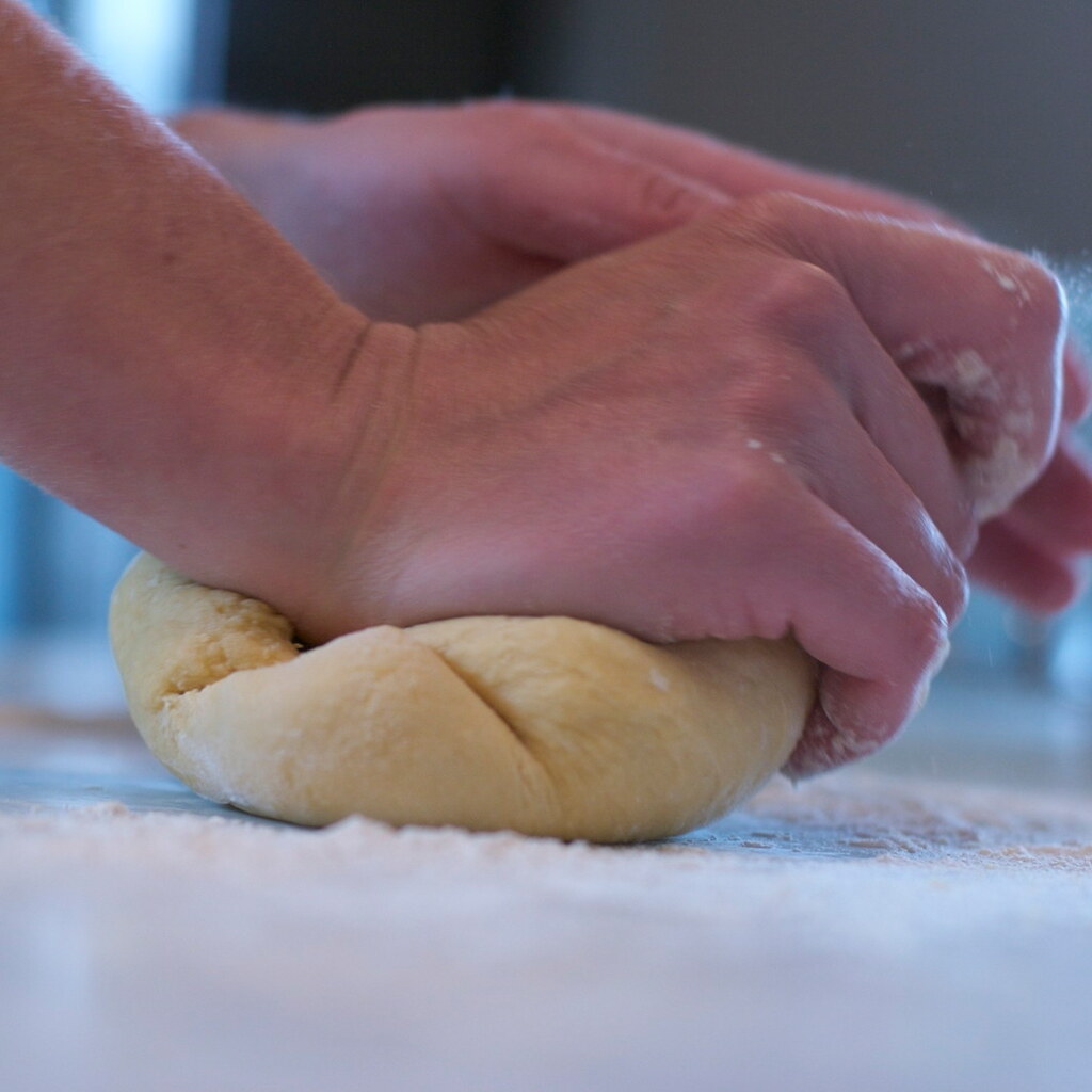 Photo of someone kneading dough.