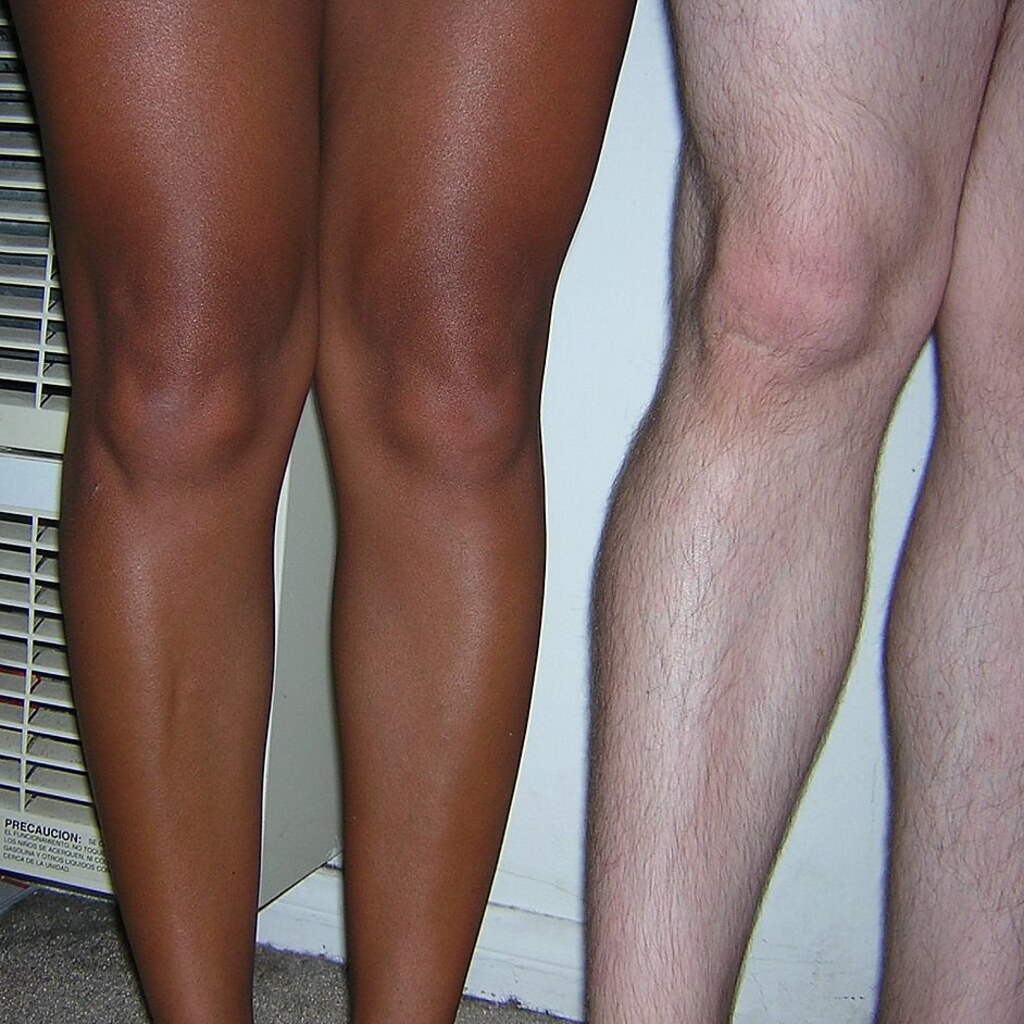 Photo of people's knees.