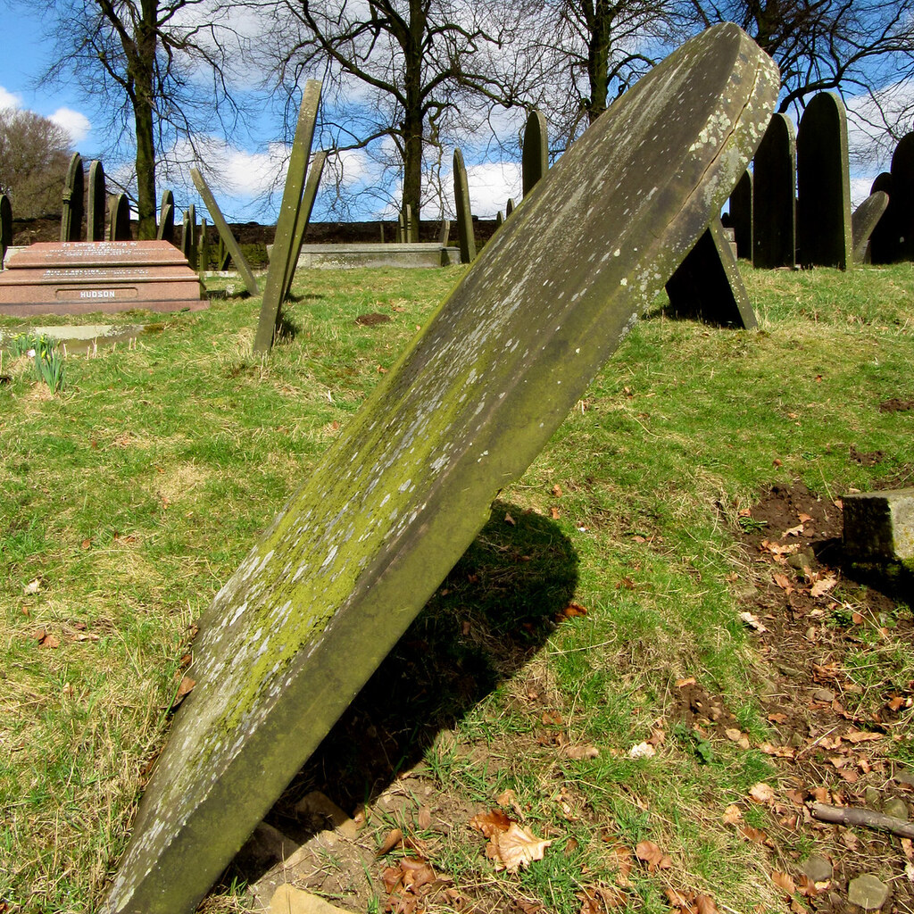 Photo of a leaning gravestone