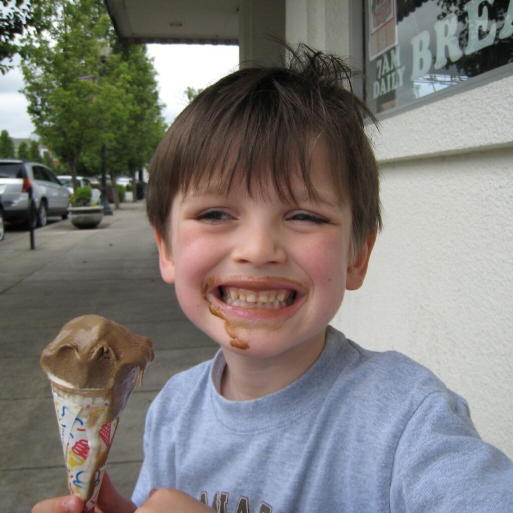 Photo of a boy eating icecream