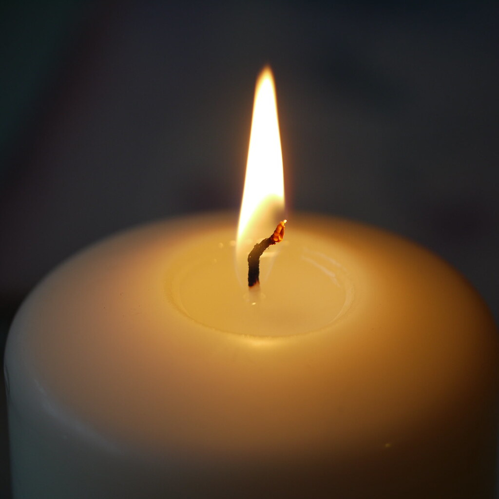 Photo of a lit candle