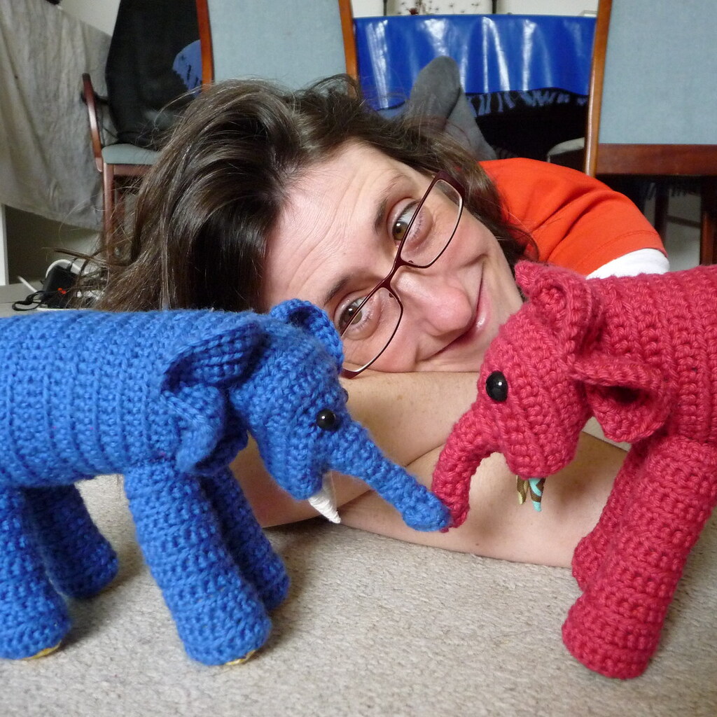 Photo of a woman who made some knitted elephants