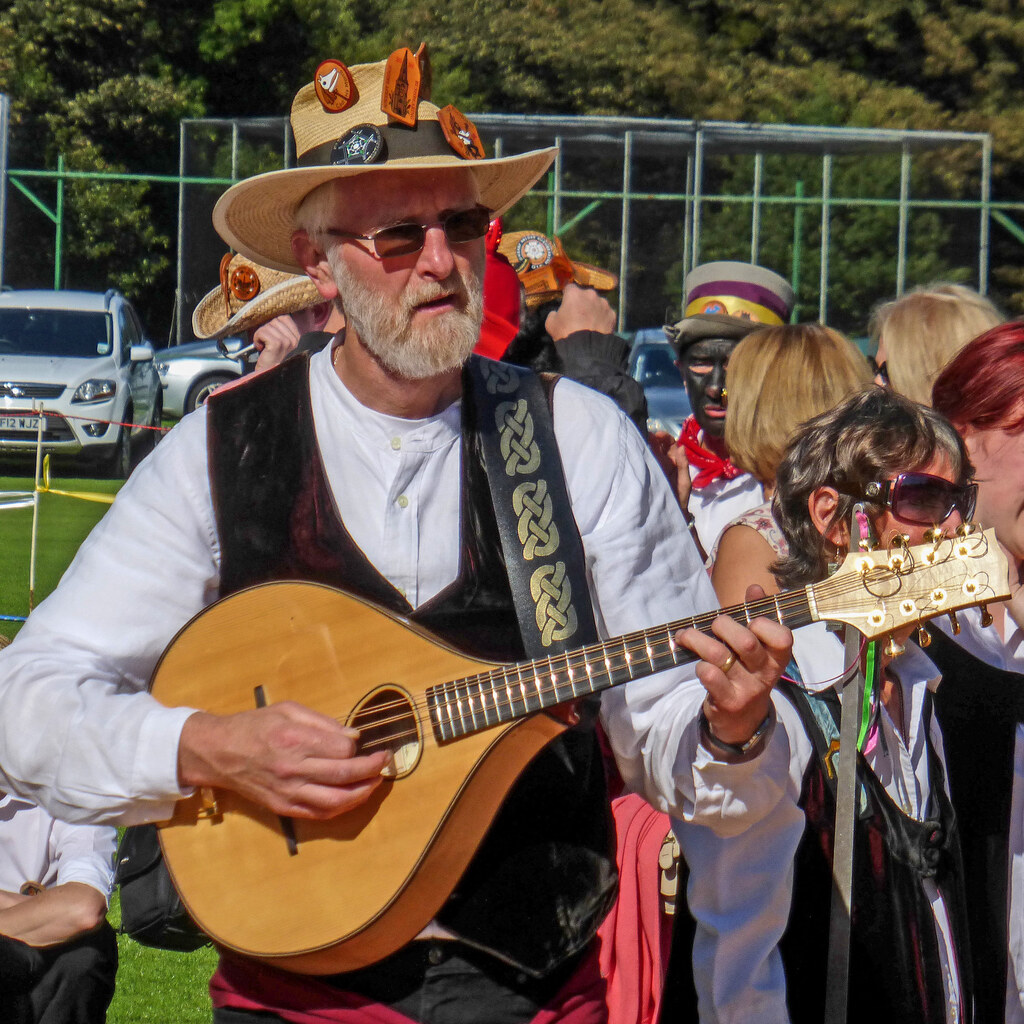 Photo of a man playing a mandolin