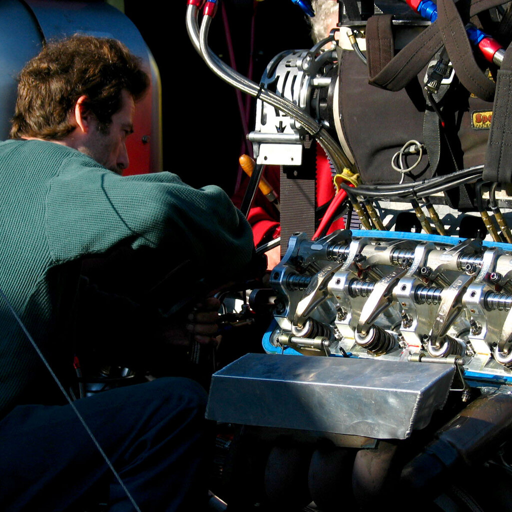 Photo of a mechanic fixing a car