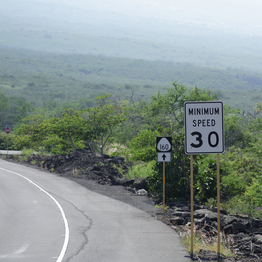 Photo of a sign advising a minimum speed
