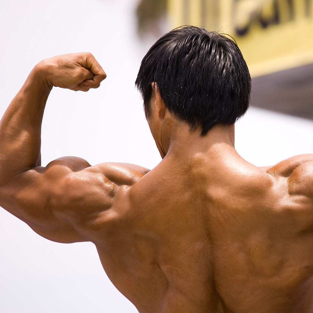 Photo of a man flexing his muscles