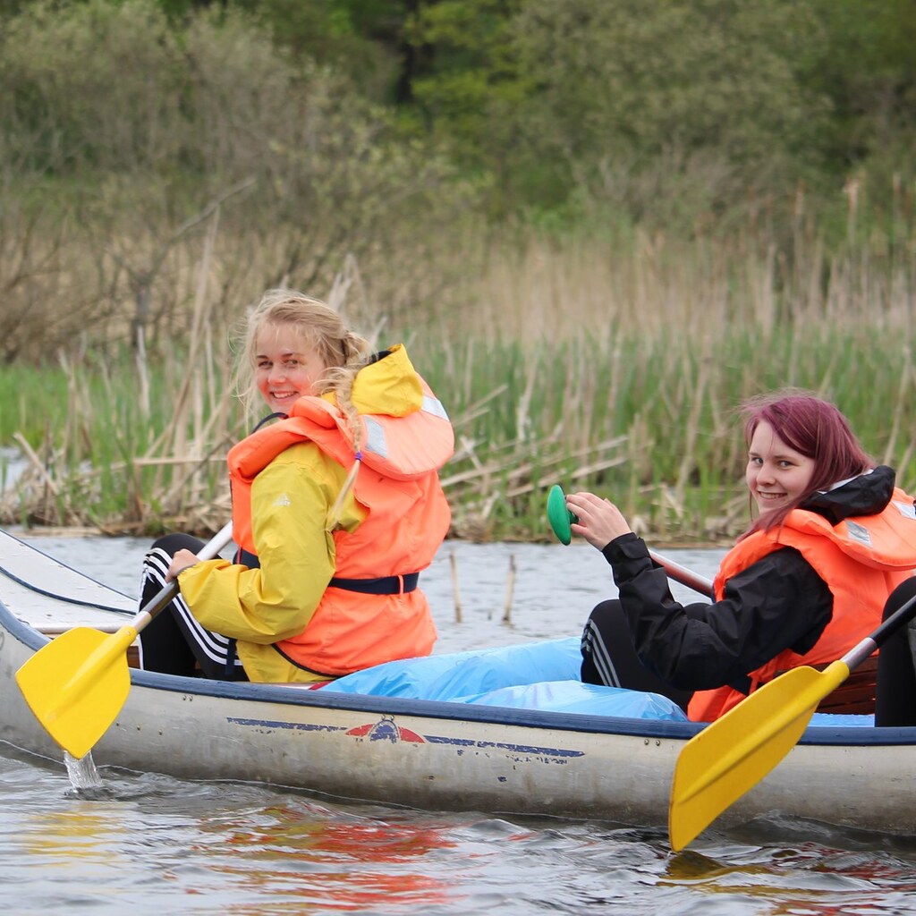Photo of people padding with oars