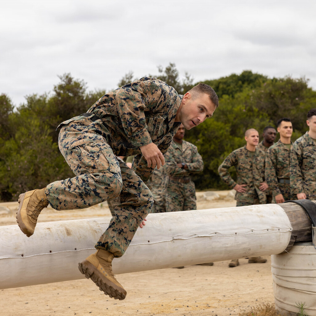 Photo of men going through an obstacle course