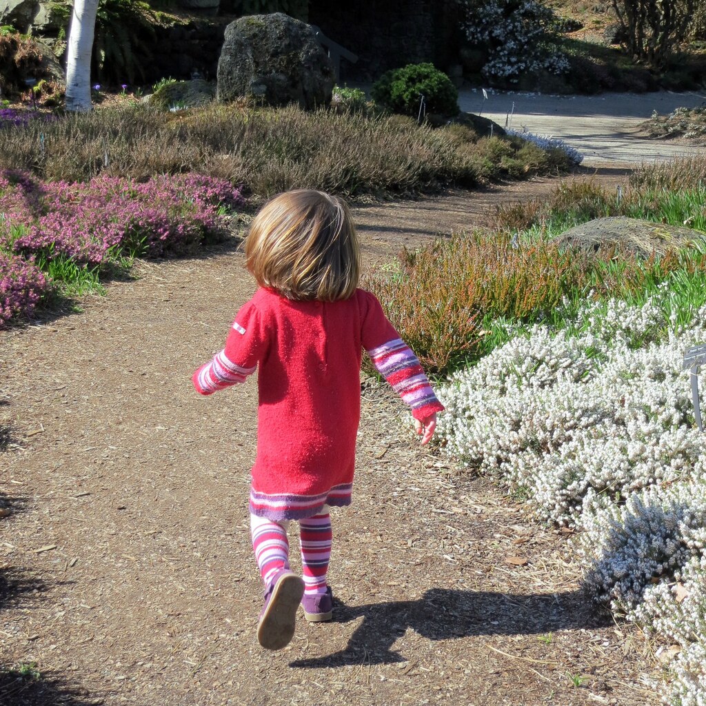 Photo of a little girl playing outside