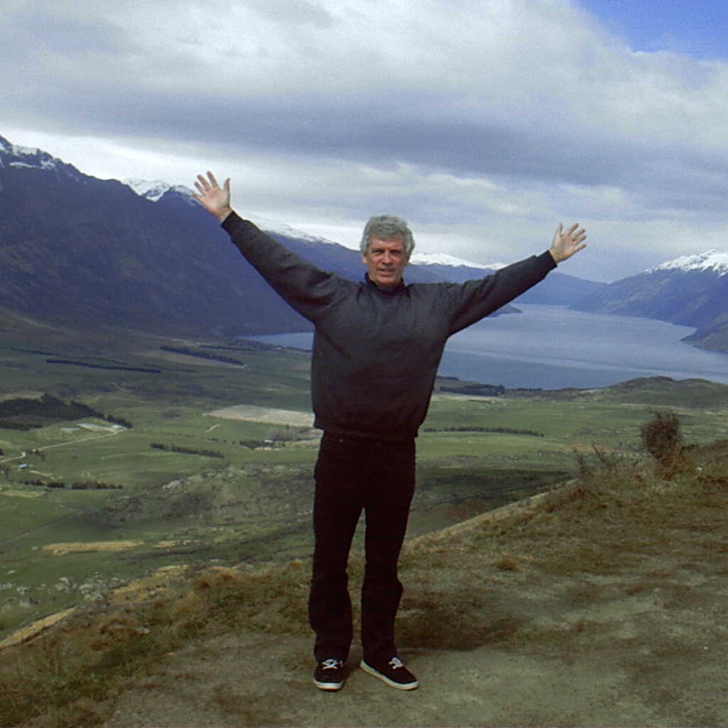 Man with outstretched arms.