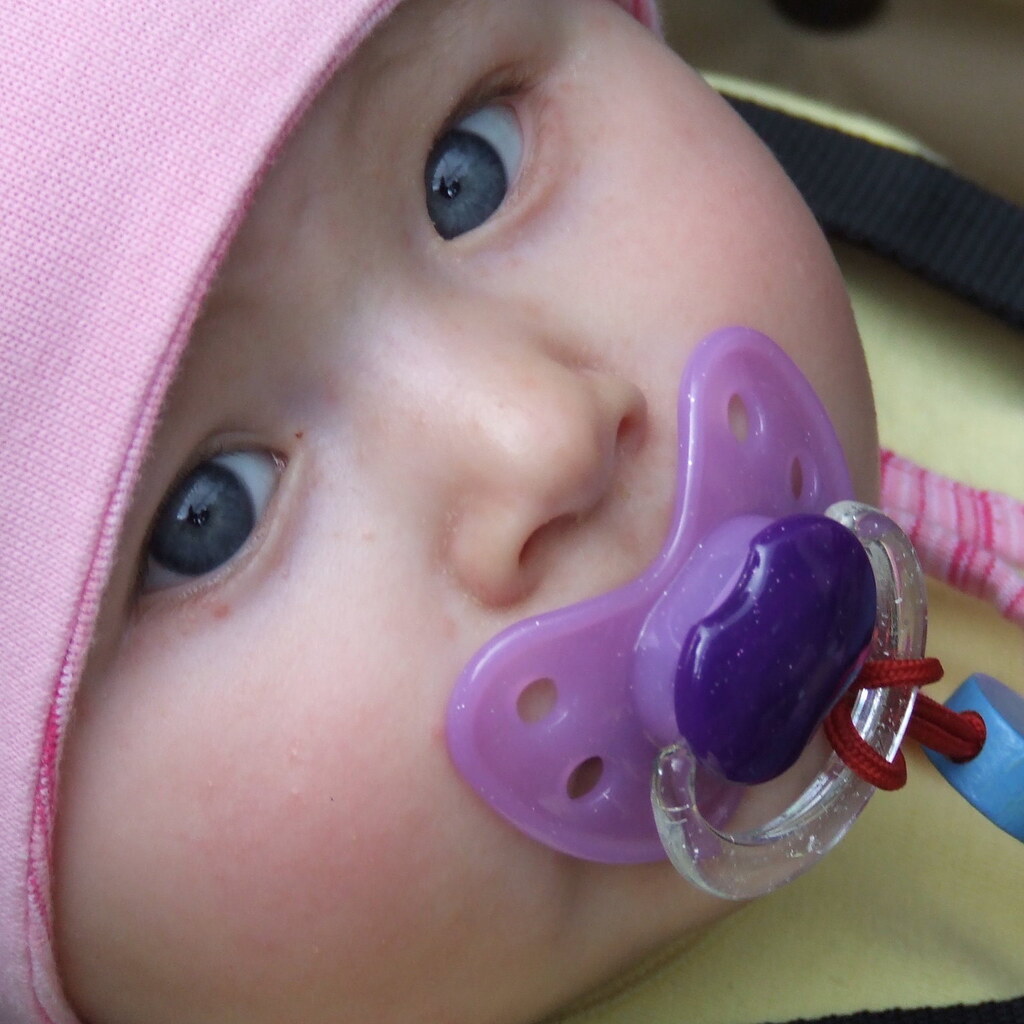 Photo of a baby with a pacifier