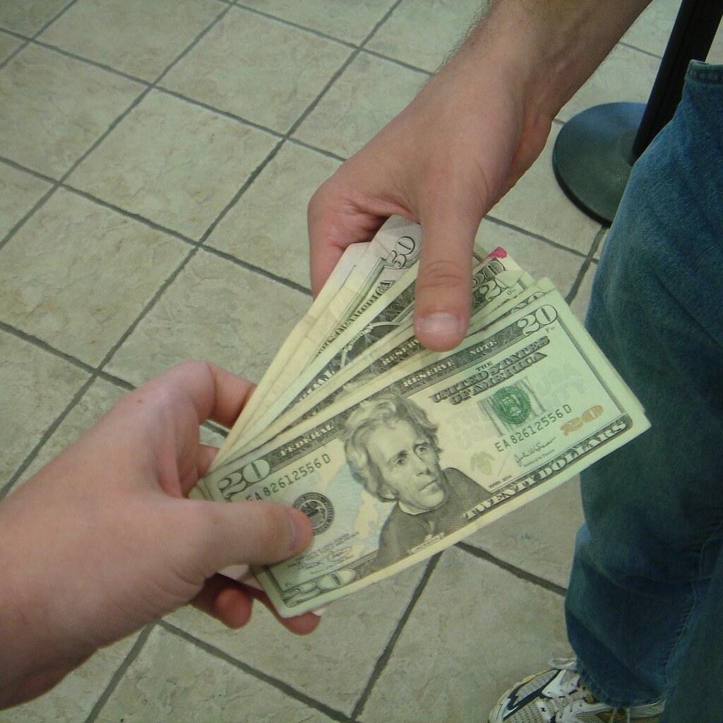 Photo of someone being paid