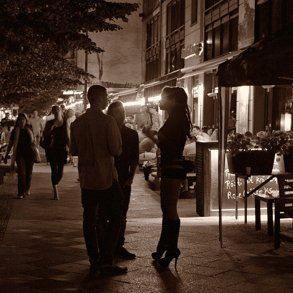 Photo of two men and a prostitute
