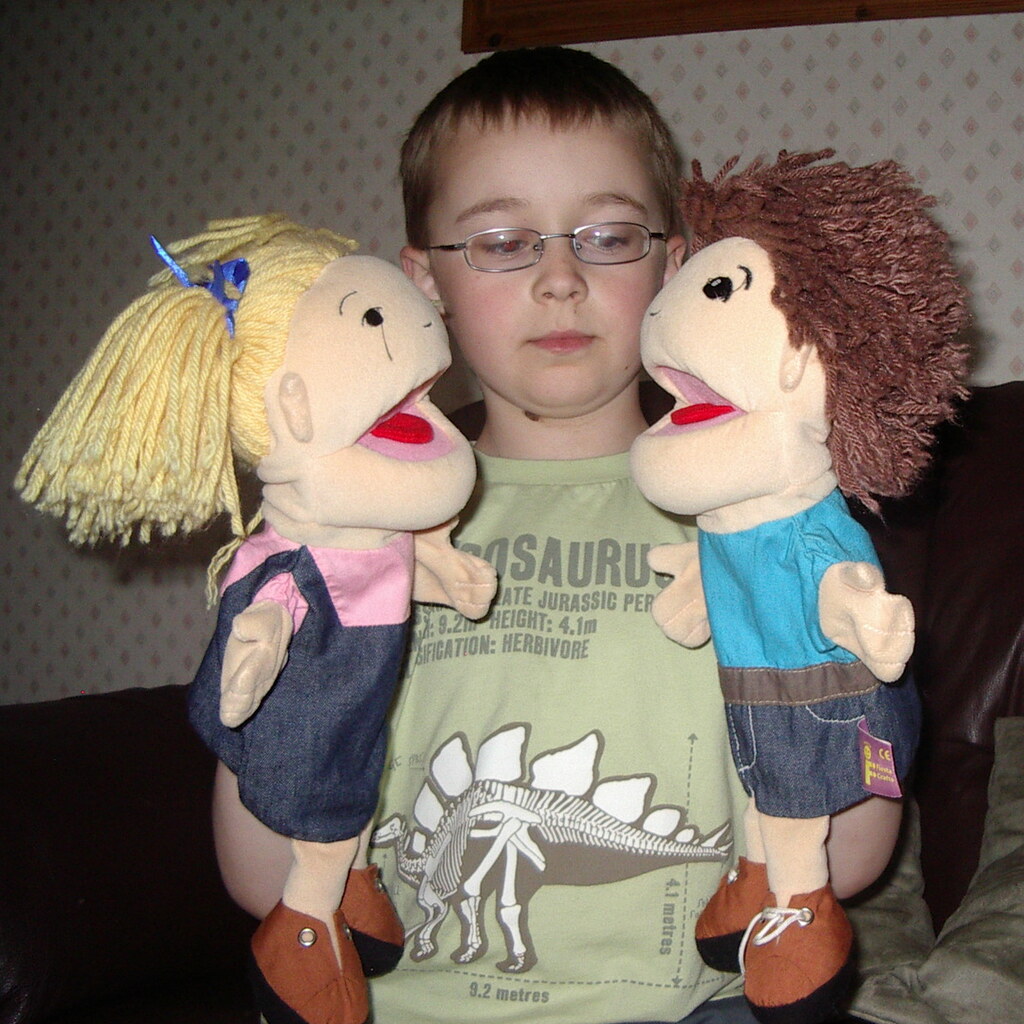 Photo of a boy with puppets