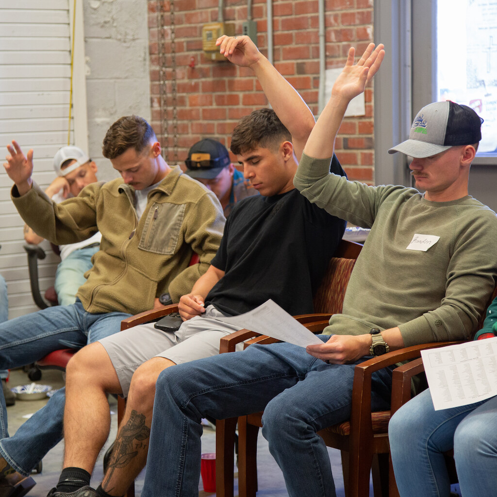 Photo of people with raised hands