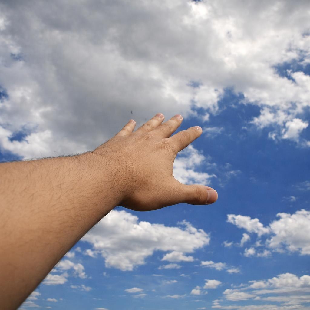 Photo of someone reaching for the sky