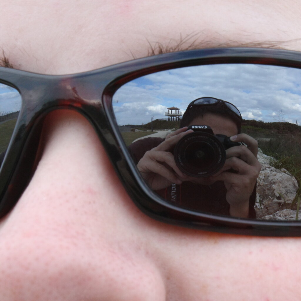 Photo of a man with reflective sunglasses