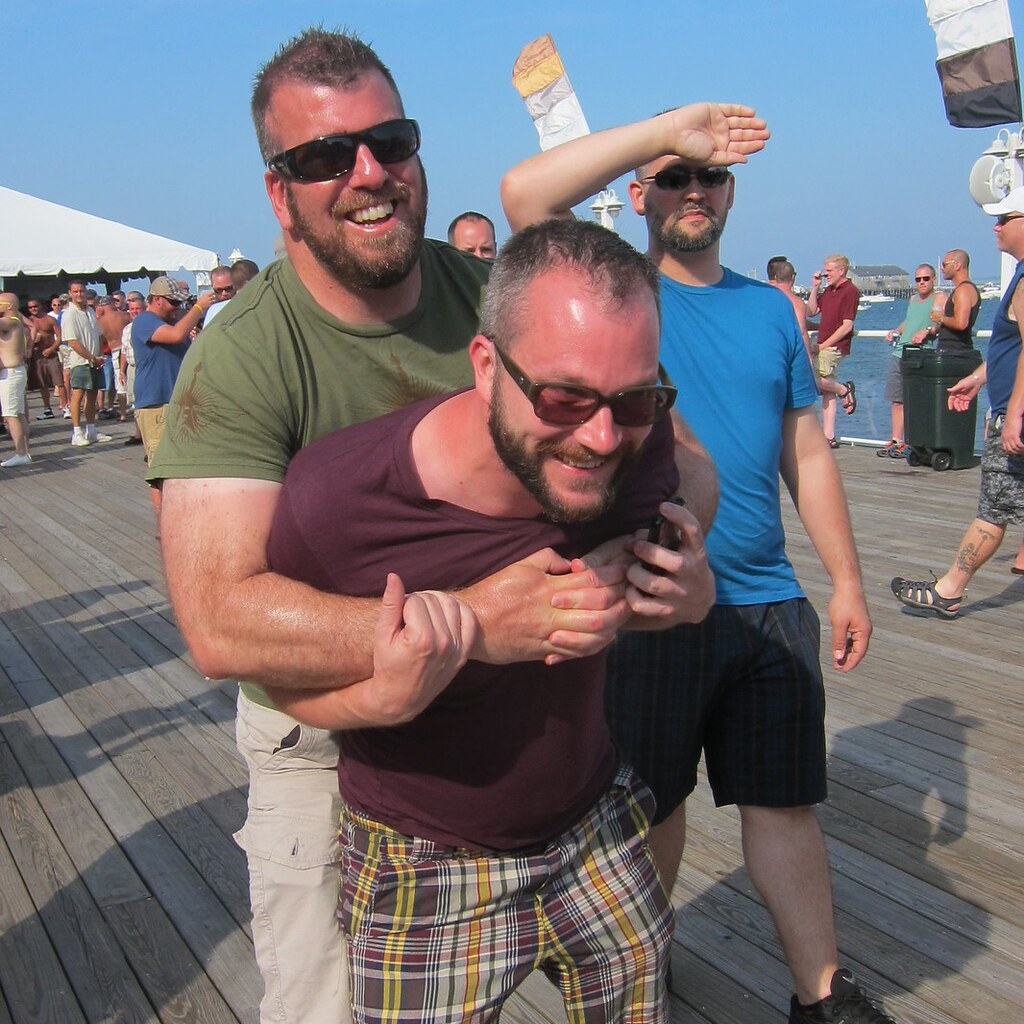 Photo of a man restraining another man