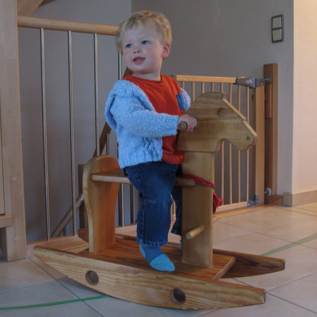 Photo of a child on a rocking horse