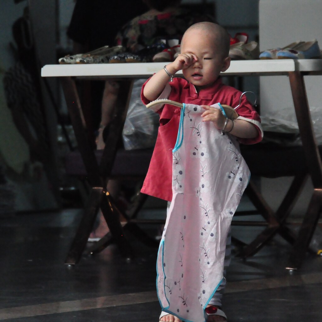 Photo of a child rubbing their eyes