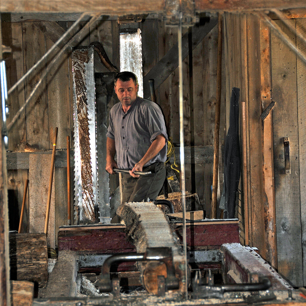 Photo of a man working in a sawmill