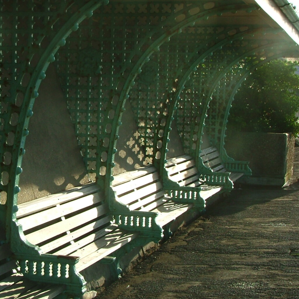 Photo of some benches in the sun