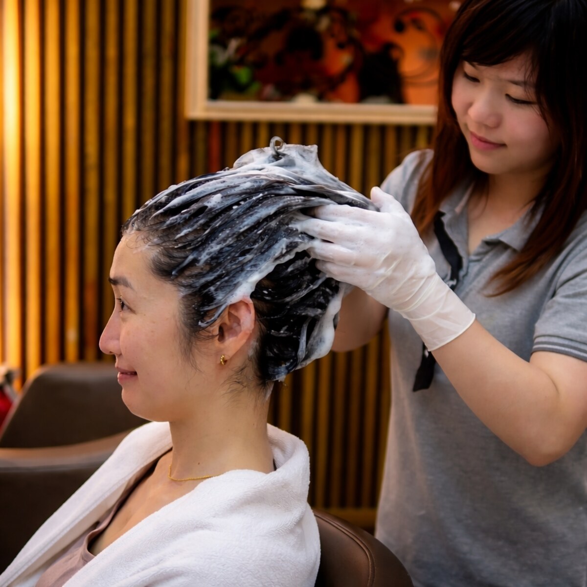 Photo of a woman having her hair washed