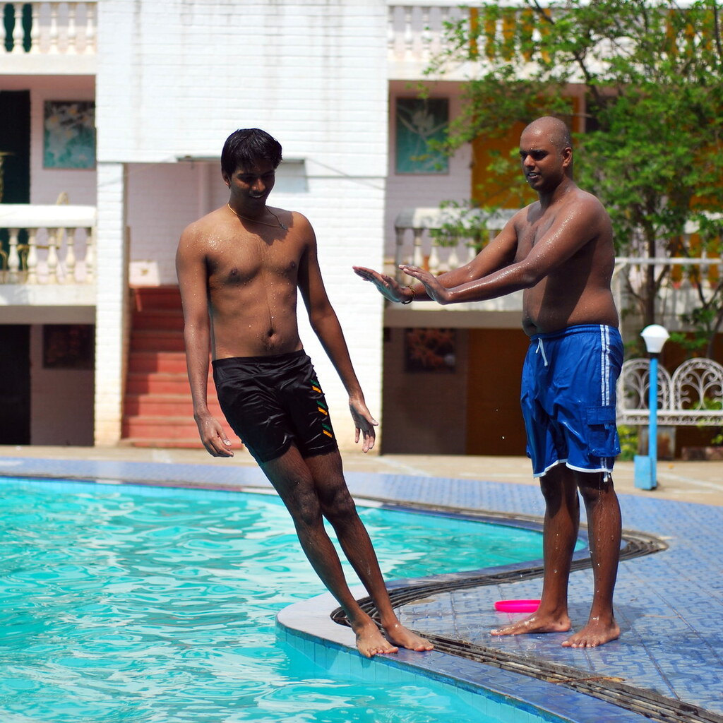 Photo of a man shoving another man
