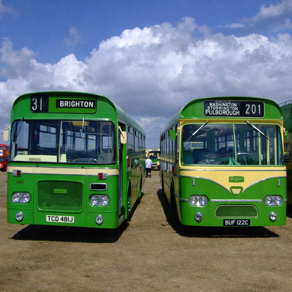 Photo of two similar looking buses