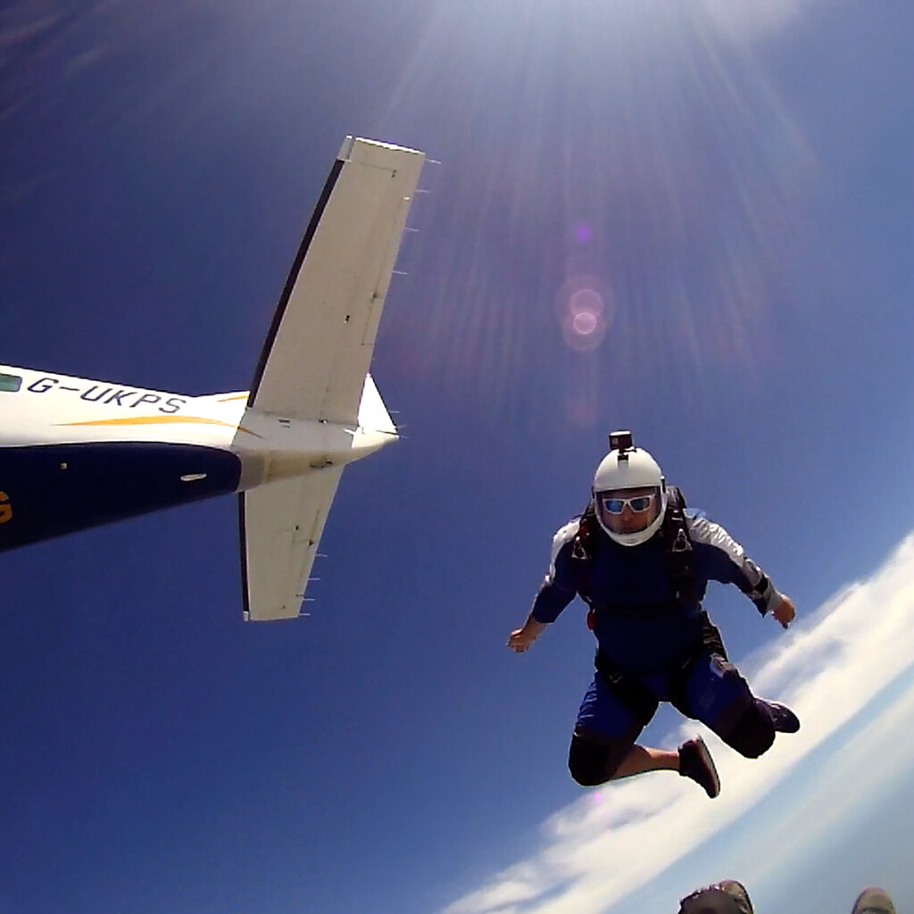 Photo of a man jumping out of a plane