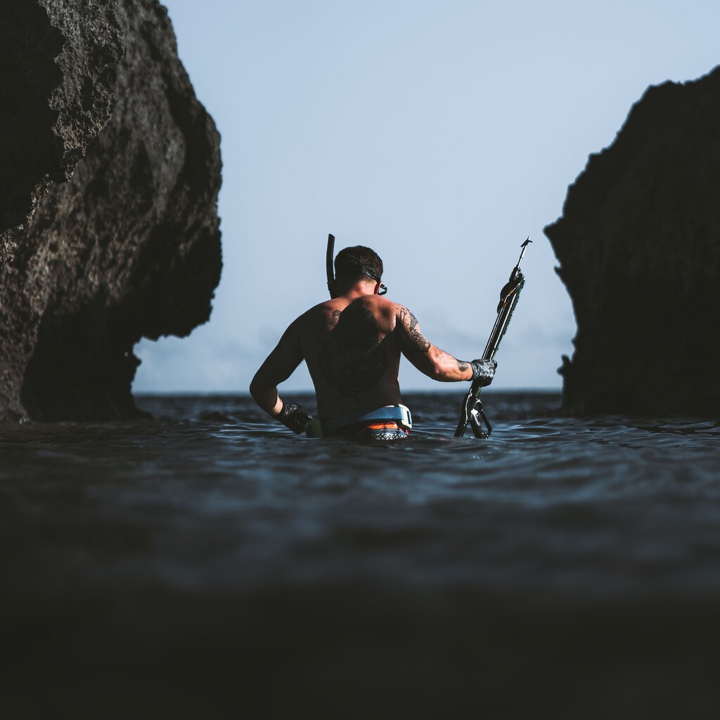 A photo of a diver holding a spear gun