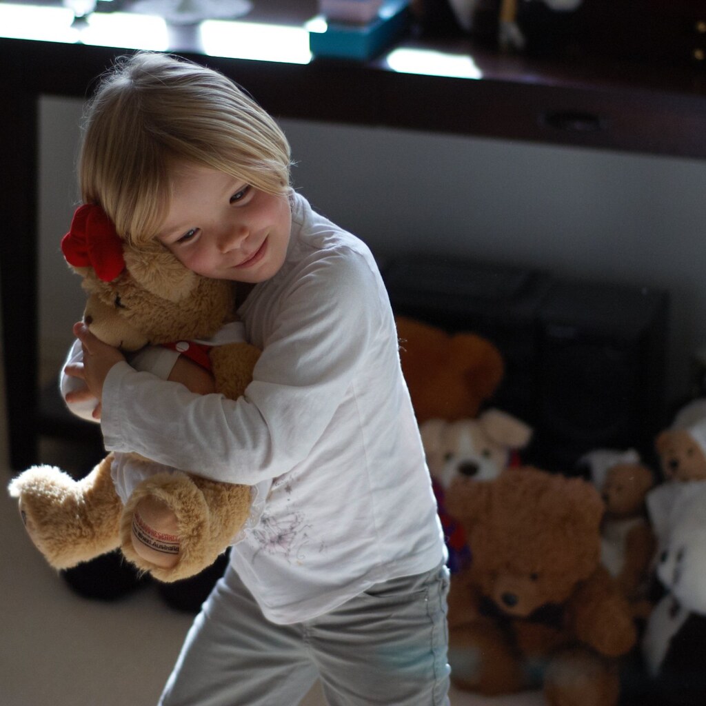 Photo of a girl and her special teddy