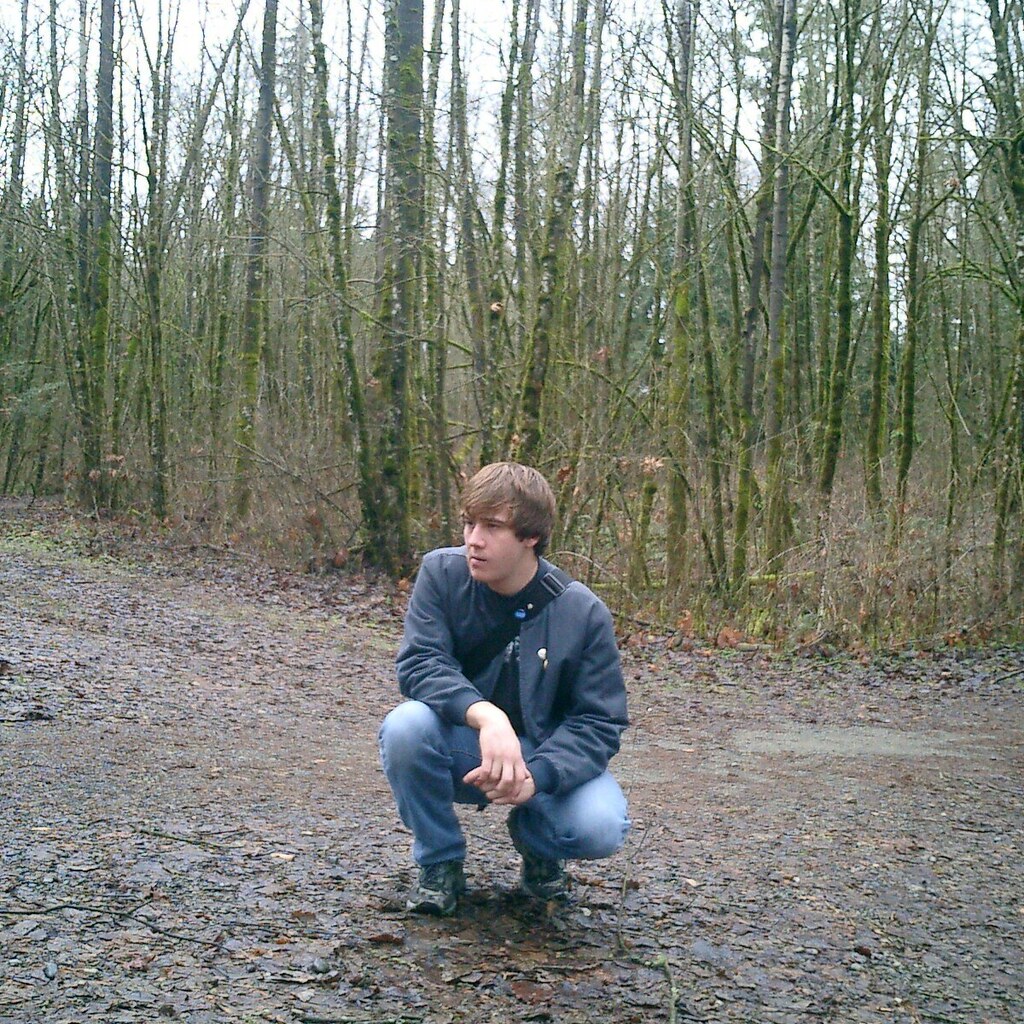 Photo of a man squatting