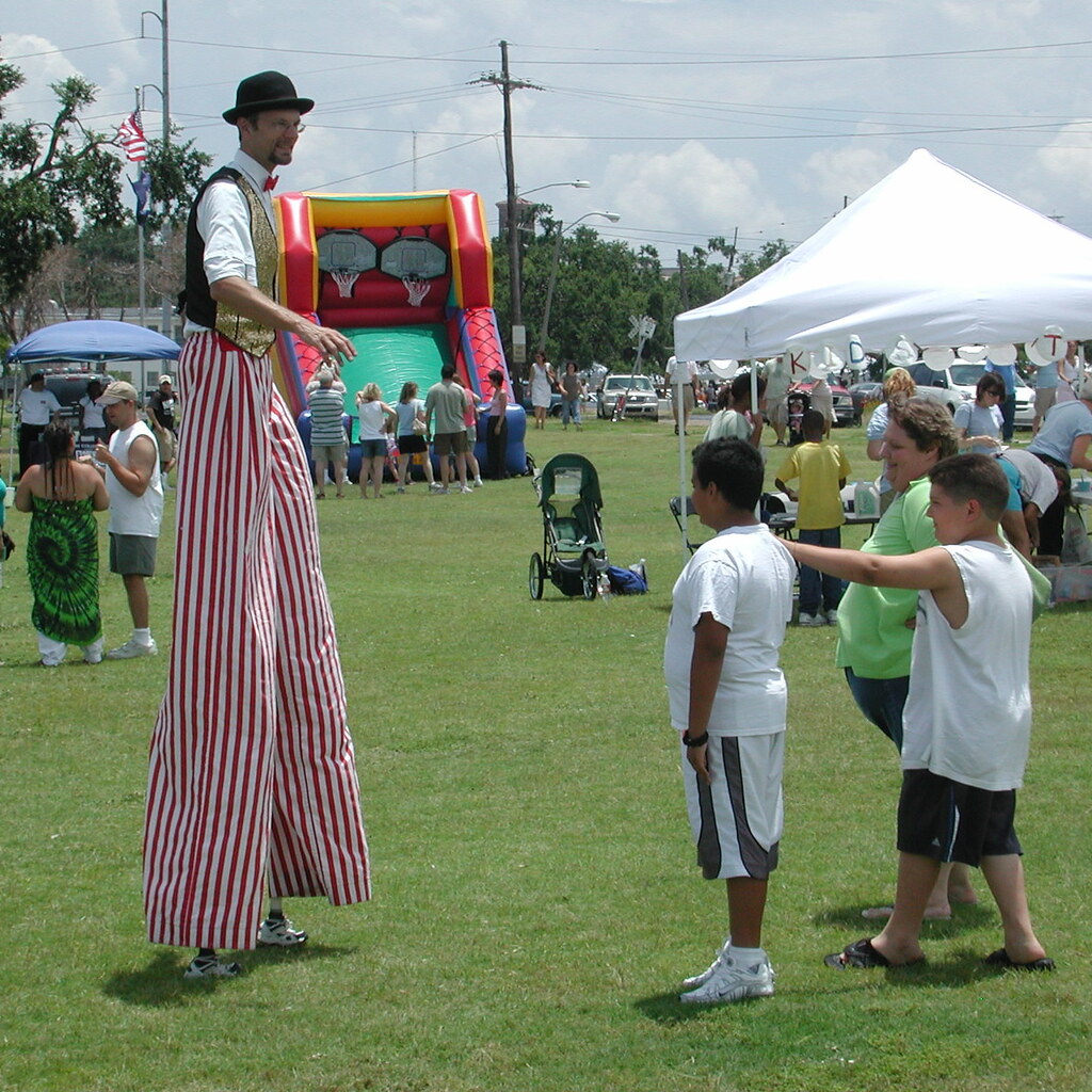 Photo of a man wearing stilts