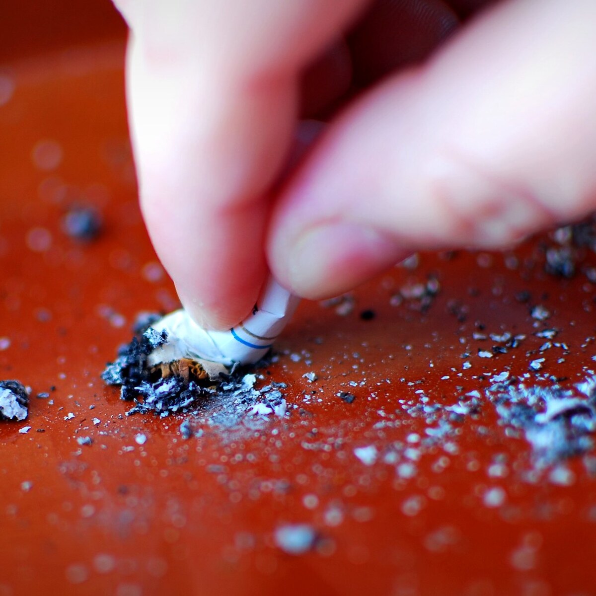 Photo of a cigarette being stubbed out