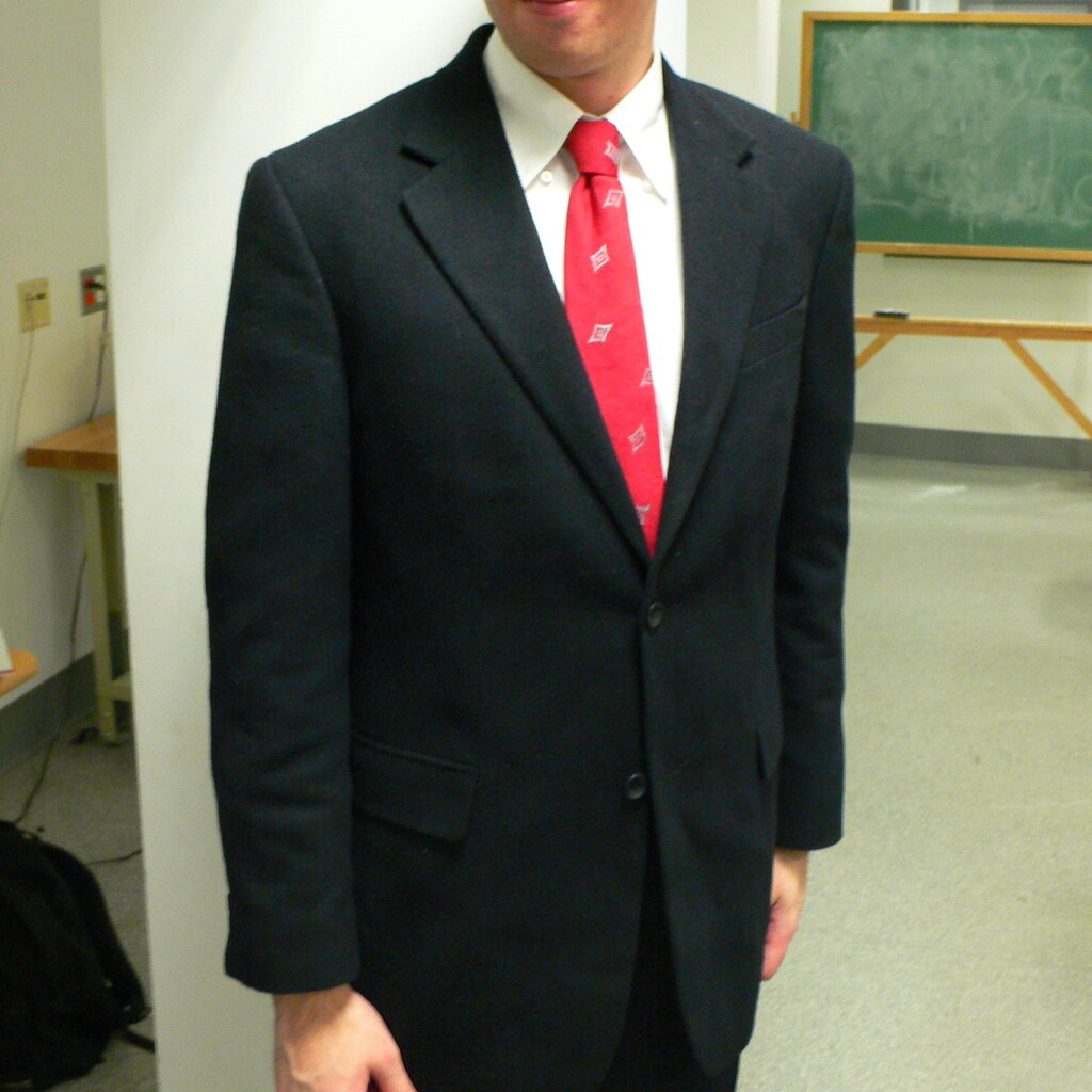 Photo of a man wearing a suit.