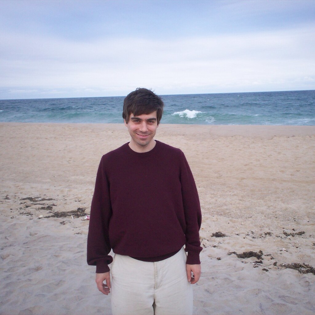 Photo of a man wearing a sweater.