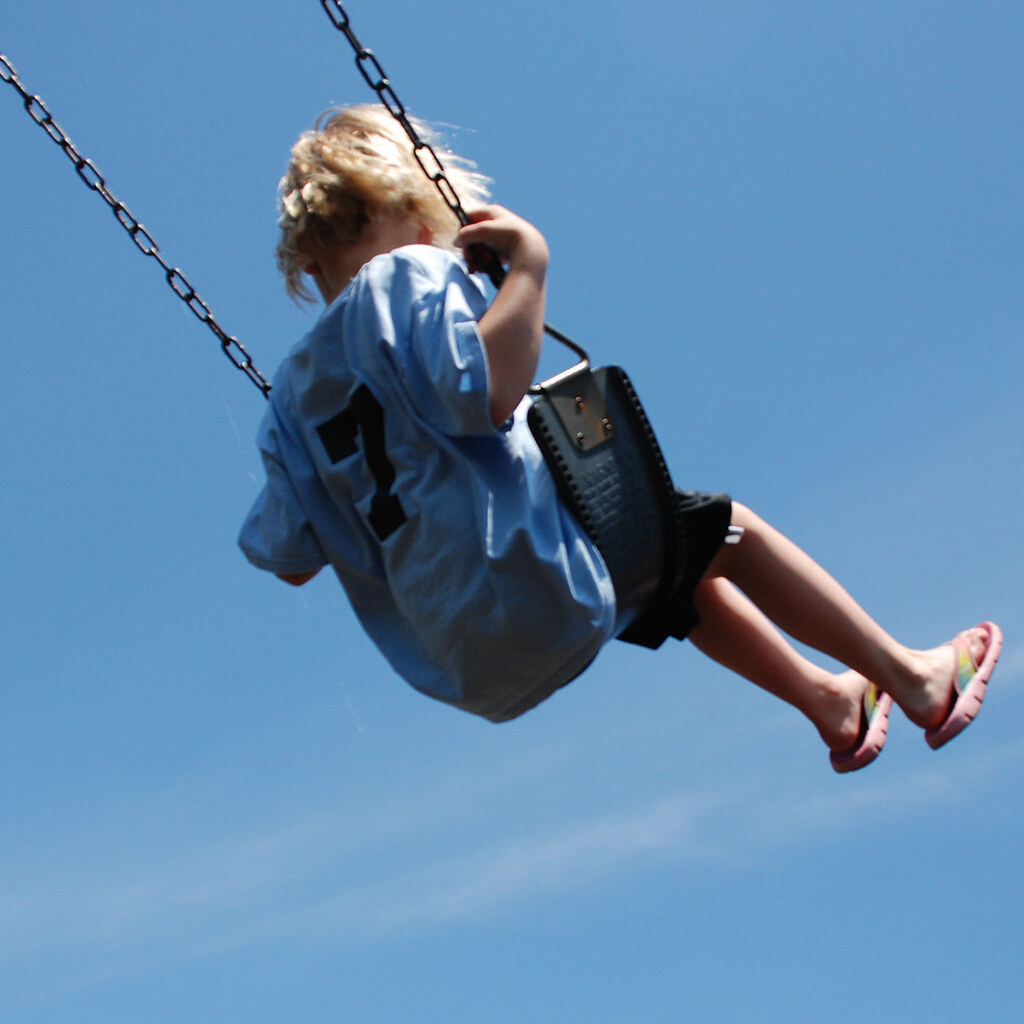 Photo of a girl swinging