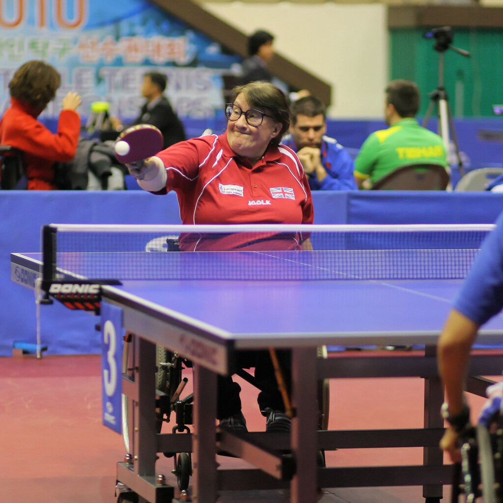 Photo of a woman playing table tennis