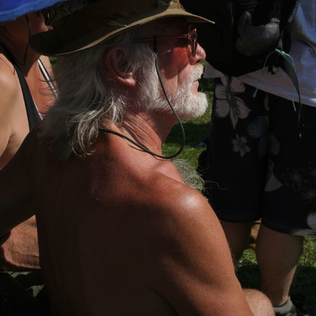 Photo of a tanned man.