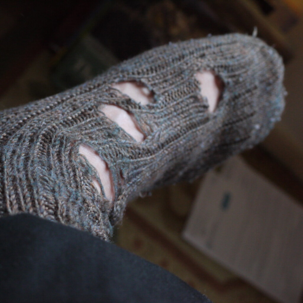 Photo of a threadbare sock