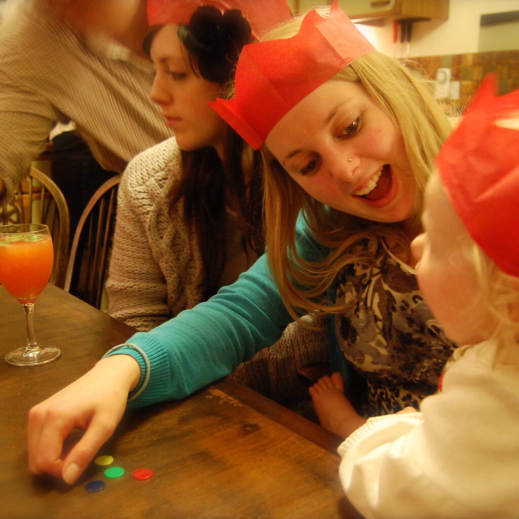 Photo of people with tiddlywinks